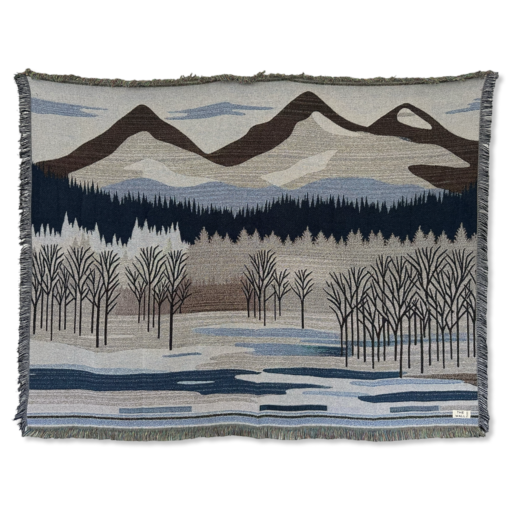 A wall rug with a mountain landscape