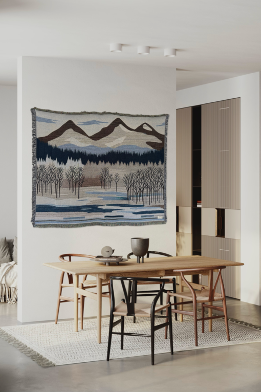 A wall rug with a mountain landscape